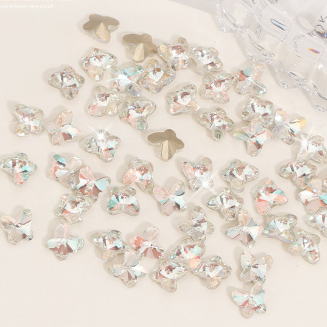 White Butterfly Nail Gem: Elevate your nail art with a pristine white butterfly gem, offering a timeless elegance and sophistication to your manicure.