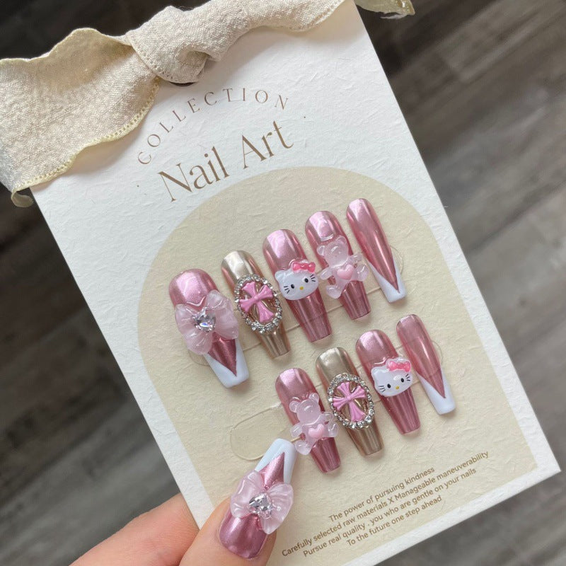 Hello Kitty - Chrome press-on nails showcased on a display card, featuring glossy chrome pink nails with Hello Kitty embellishments and crystal flower accents for a stylish look.
