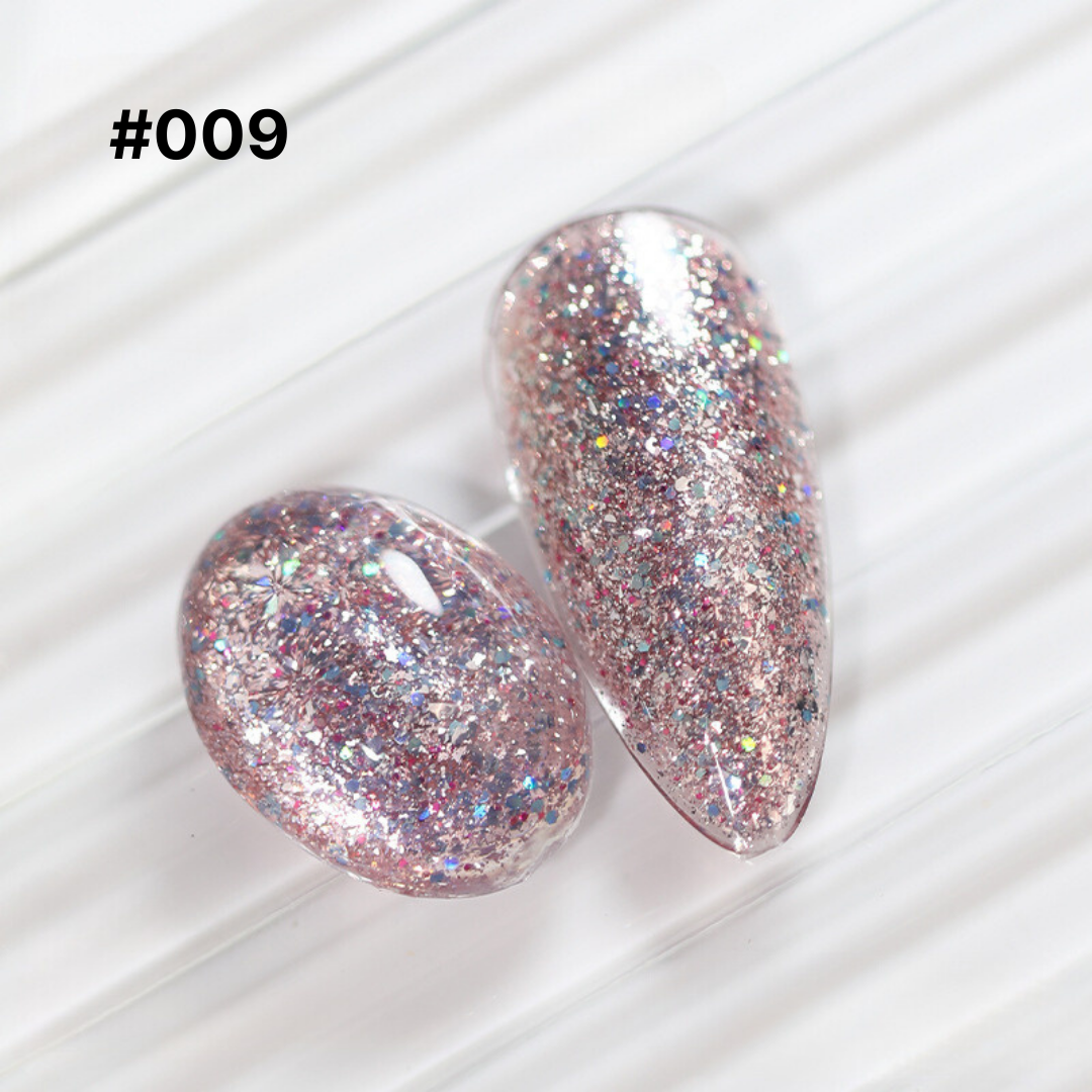 Soft coral glitter gel polish #009, with a mix of fine and chunky glitter, offering a gentle and feminine nail look.