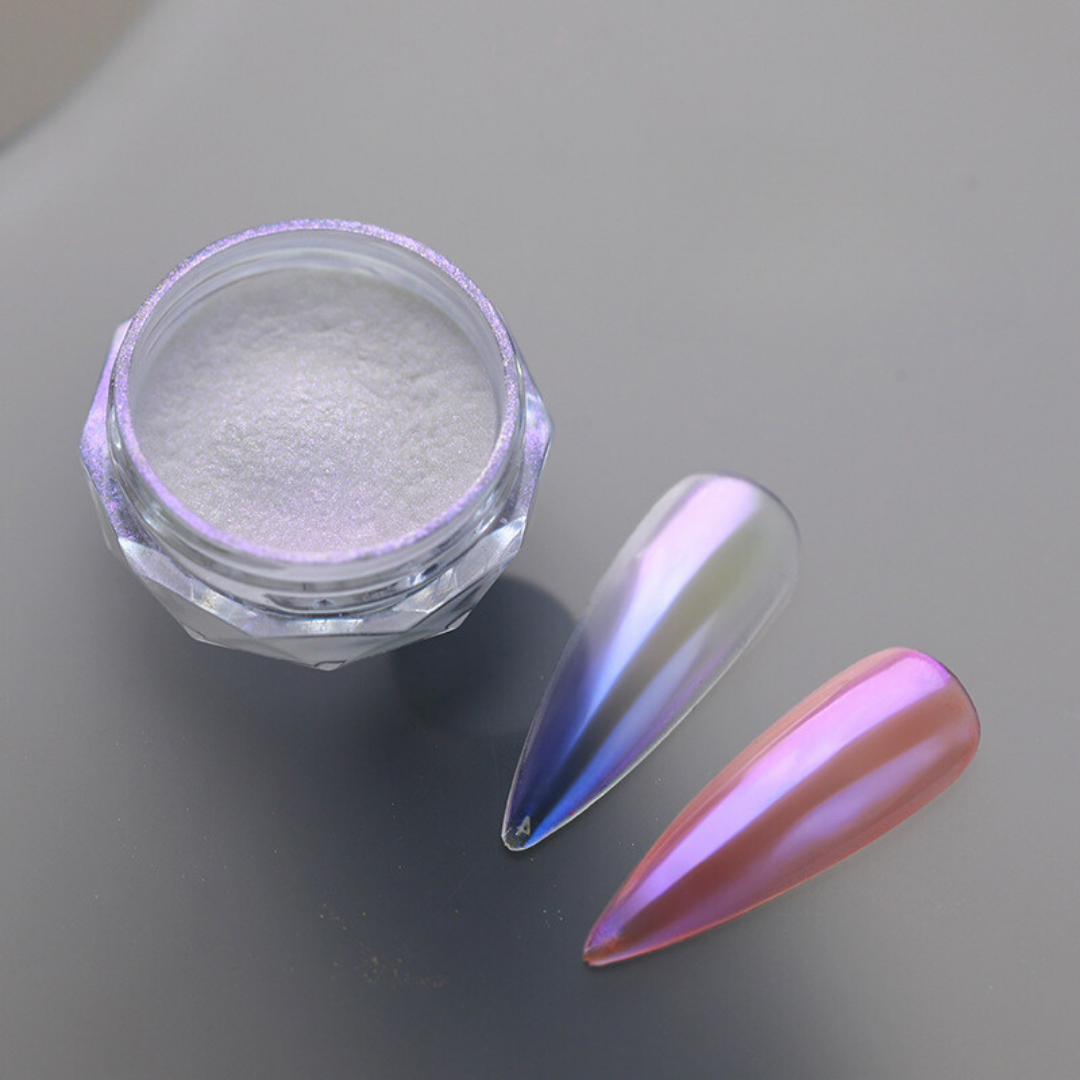 An image showcasing BOMD Chrome Nail Powder applied to fake nails, displaying a striking mirror-like finish with a dazzling metallic sheen, highlighting the brilliance and versatility of the product. Pink / Deep purple chrome