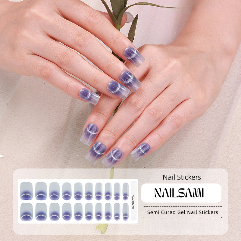 Hand with nails in a soft blue gel nail sticker design with daisy patterns, with a NAILSAMI gel nail sticker sheet displayed below showcasing the same daisy design.