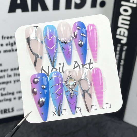 Futuristic Halloween nail designs in purple and blue with 3D elements