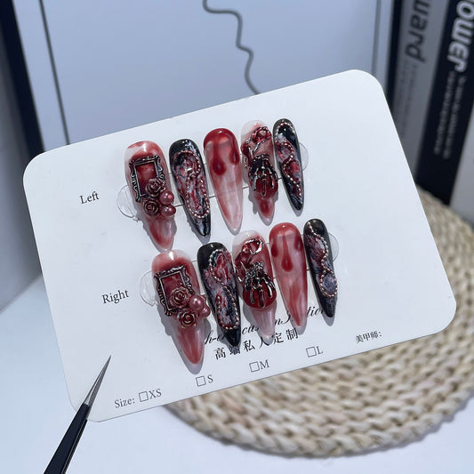 Halloween nails bloody with dark red and black color scheme featuring blood drip details