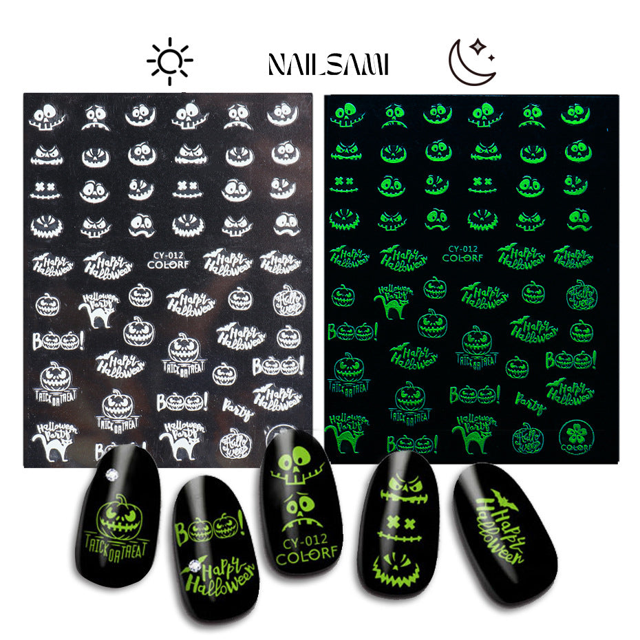 Haunted Echoes - Screaming Faces & Ghost Texts" nail stickers from NAILSAMI feature ghostly designs that glow green in the dark.