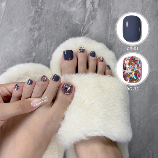 Feet in white fuzzy slippers with toenails painted taupe gel polish and silver glitter accent nail.