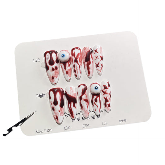 White and red Halloween nails with realistic blood effects and 3D accents