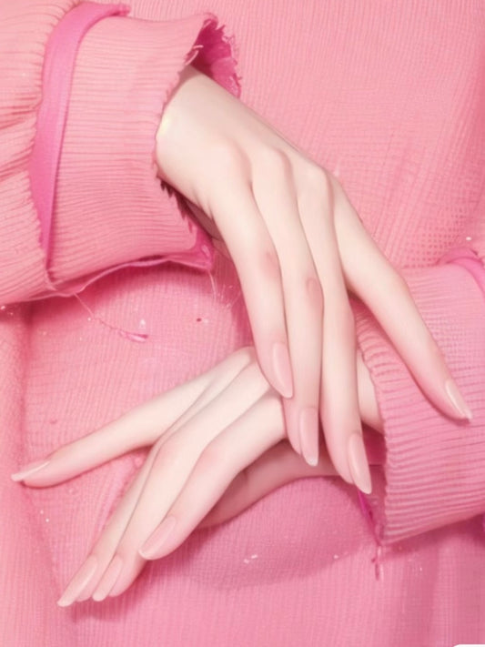 Close-up of a person applying cuticle oil to their nails, surrounded by nail care products like a nail file, clippers, and moisturizer on a soft, blue towel.