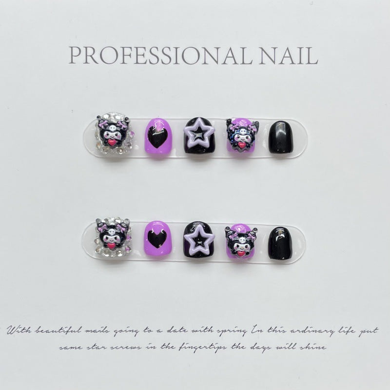 Kuromi-themed press-on nails featuring a black and pink color scheme with playful skull motifs and heart accents, embodying the mischievous yet cute style of the character.