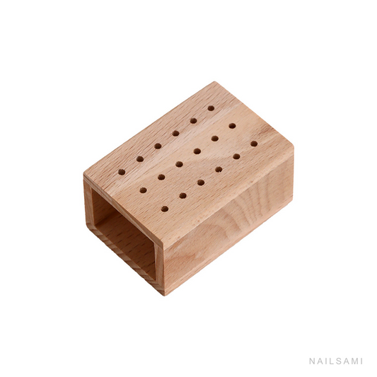18-hole natural wood nail drill bit holder on a white background
