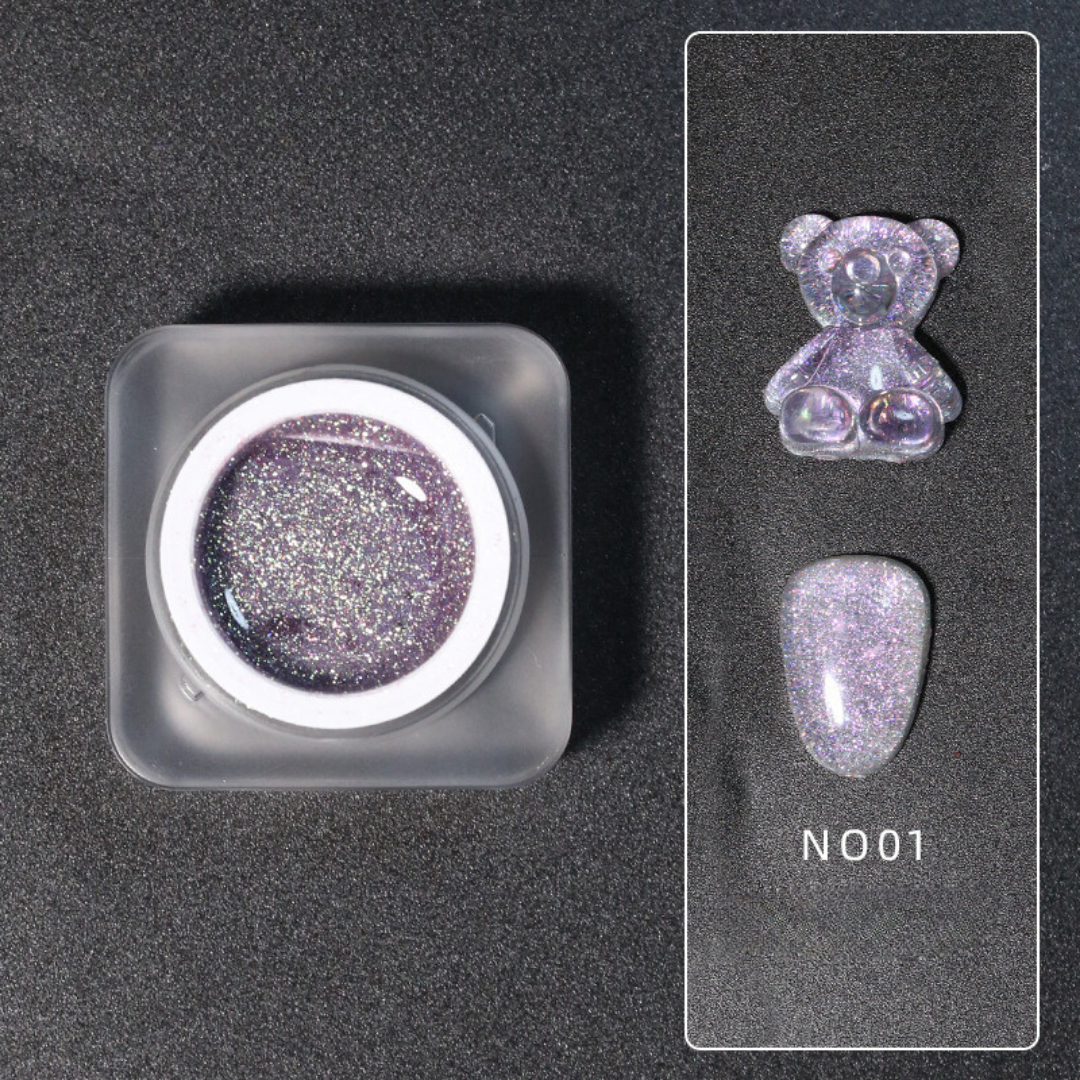 Close-up of Diamond Nail Gel N001, a shiny silver glitter gel polish in a white jar, displayed on a dark background.