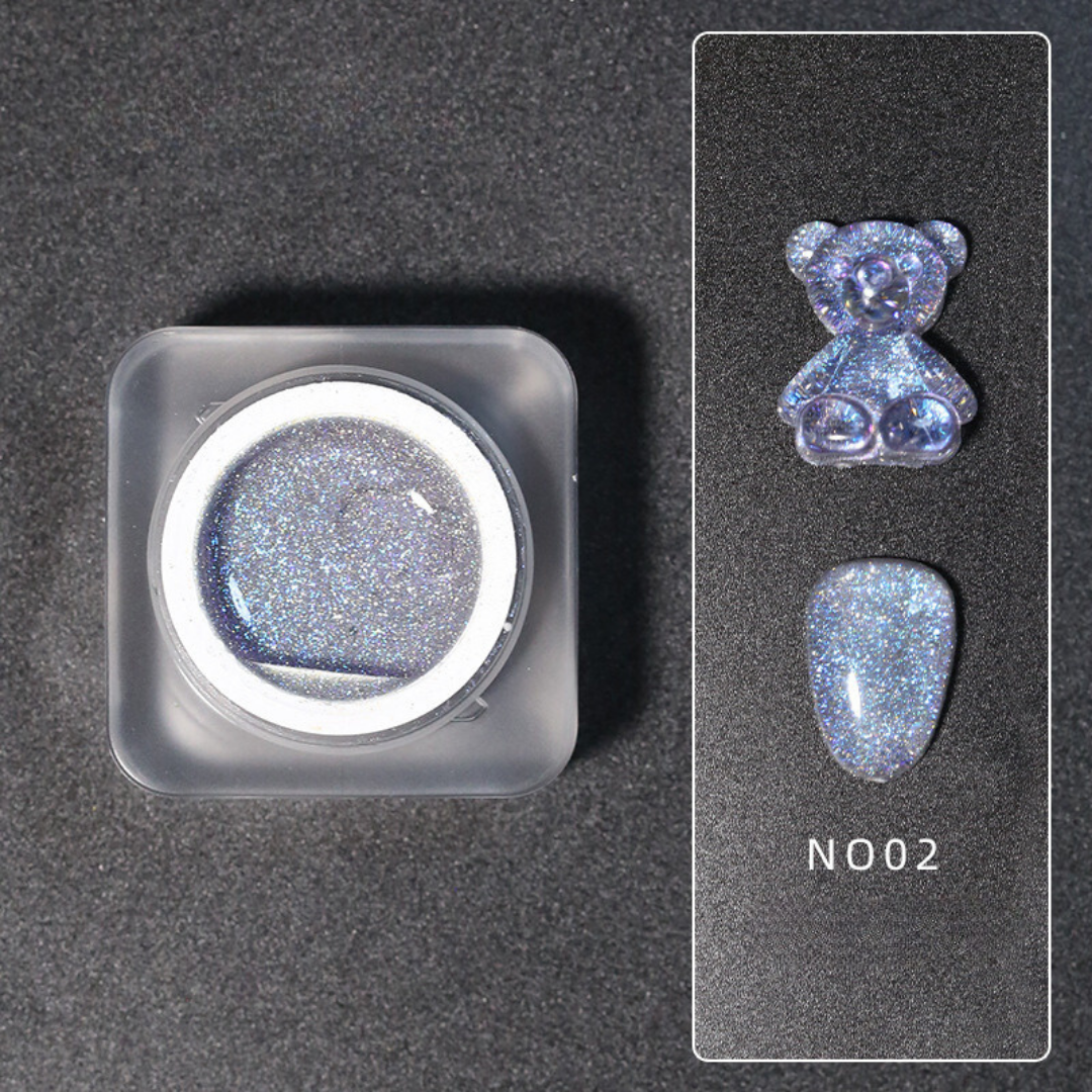 Elegant display of Diamond Nail Gel N002, a sparkling light blue glitter gel nail polish, in a luxurious presentation with a teddy bear design on top.