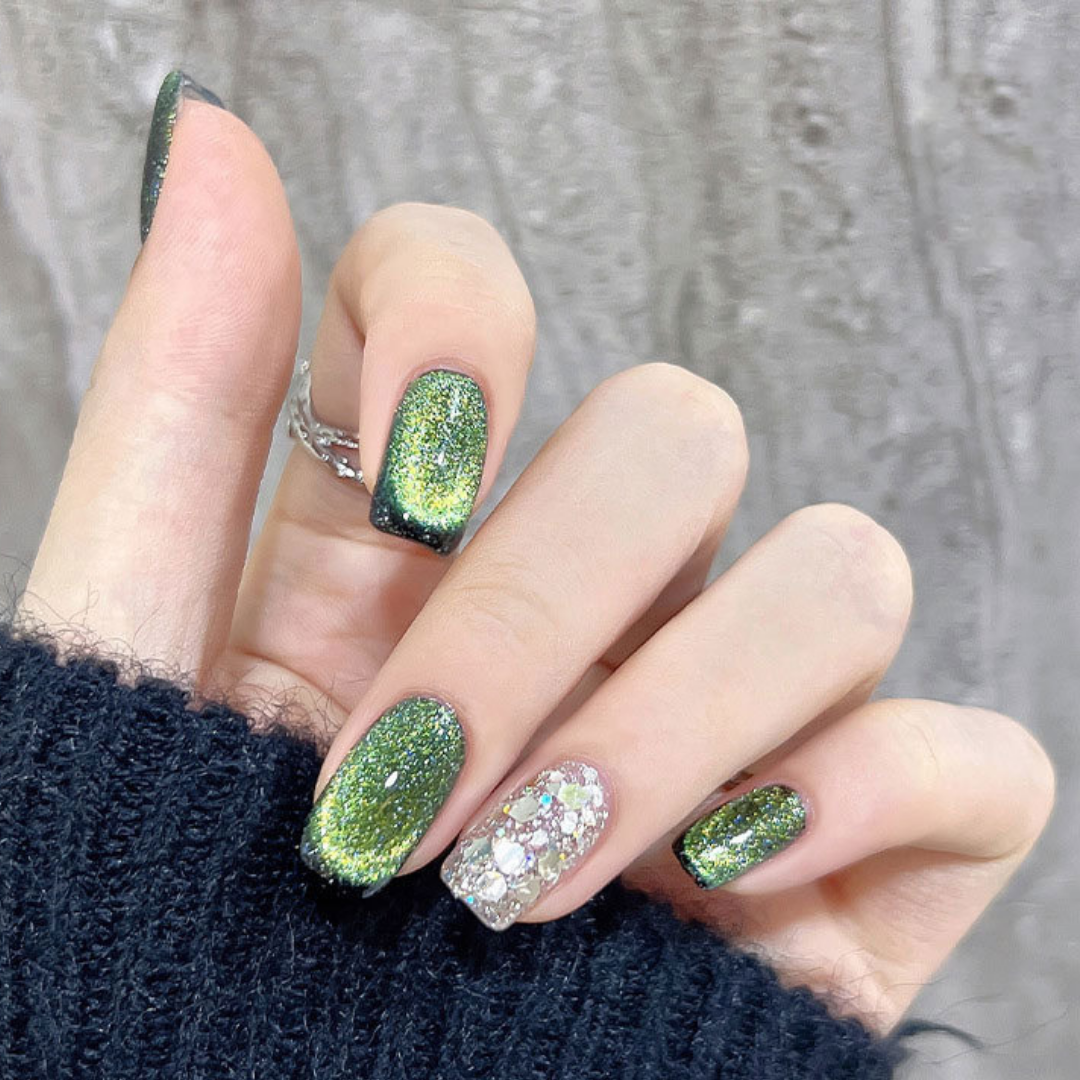 Close-up of nails with a cat eye effect: "Close-up view of fingernails painted with BOMD cat eye gel polish, featuring a mesmerizing magnetic shimmer effect in a bright green shade."