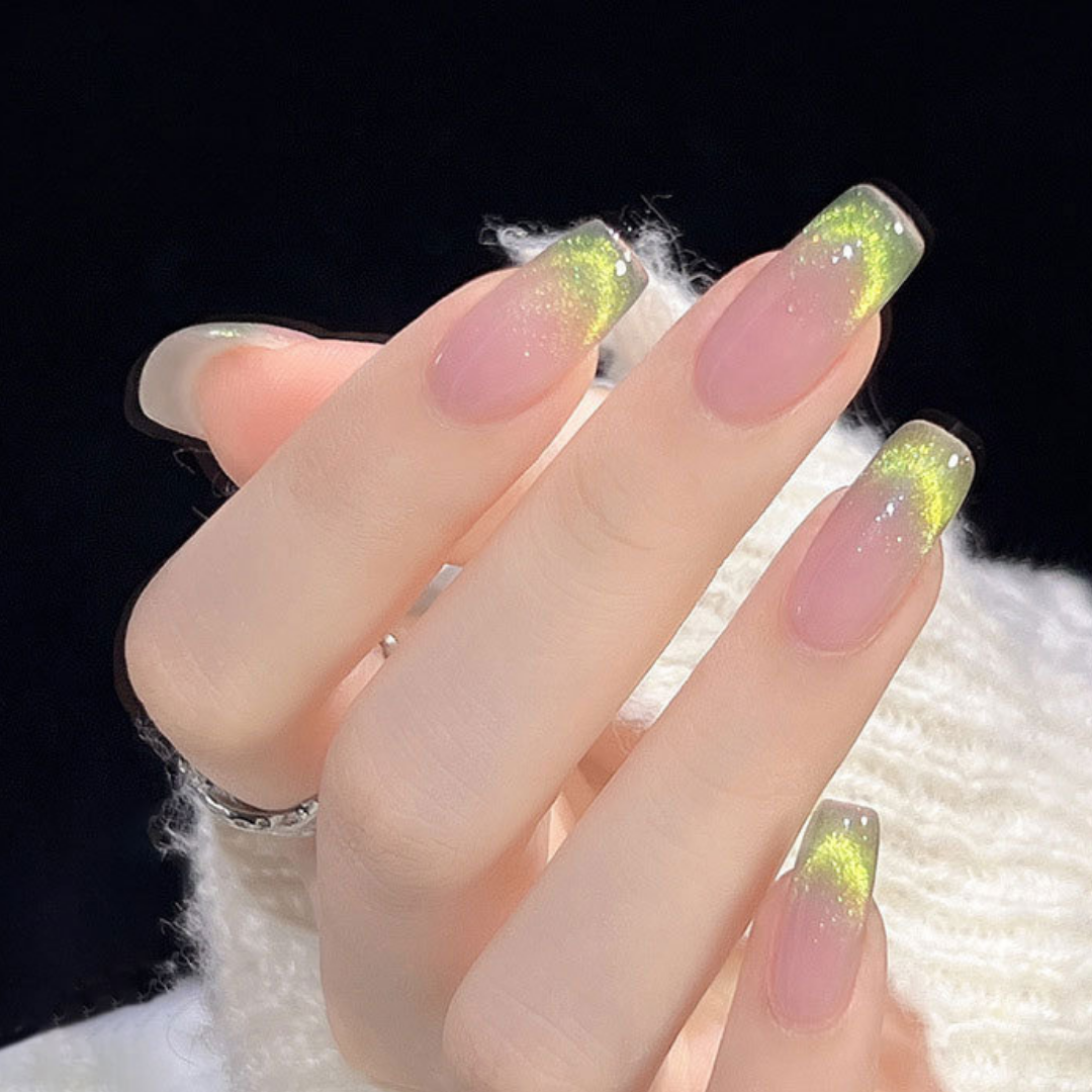 Close-up of nails with a cat eye effect: "Close-up view of fingernails painted with BOMD cat eye gel polish, featuring a mesmerizing magnetic shimmer effect in a vibrant green shade."