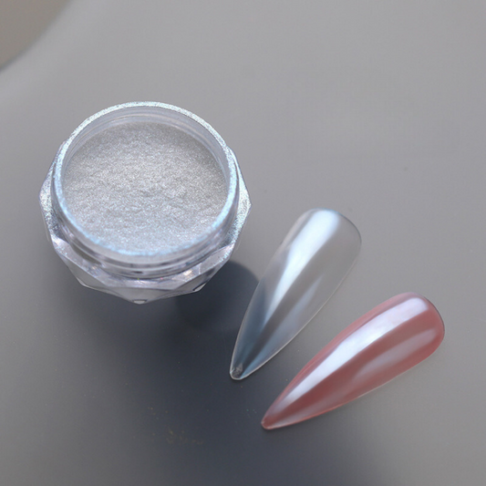 An image showcasing BOMD Chrome Nail Powder applied to fake nails, displaying a striking mirror-like finish with a dazzling metallic sheen, highlighting the brilliance and versatility of the product. Pink chrome