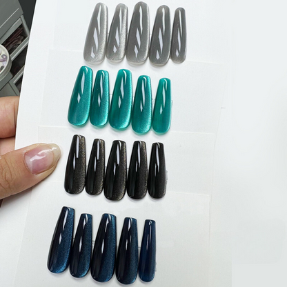 A display of four fake nails painted with the BOMD 4-Color Cat Eye Gel Polish Series, each nail showcasing a different vibrant shade with a striking cat eye effect, arranged in a row to highlight the unique magnetic shimmer of each color.