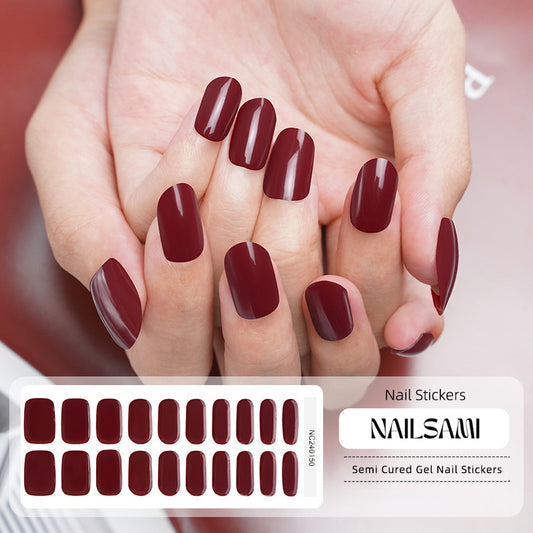 Hand with nails in a deep Bordeaux red gel nail sticker design, with a NAILSAMI gel nail sticker sheet displayed below showcasing the same red design.