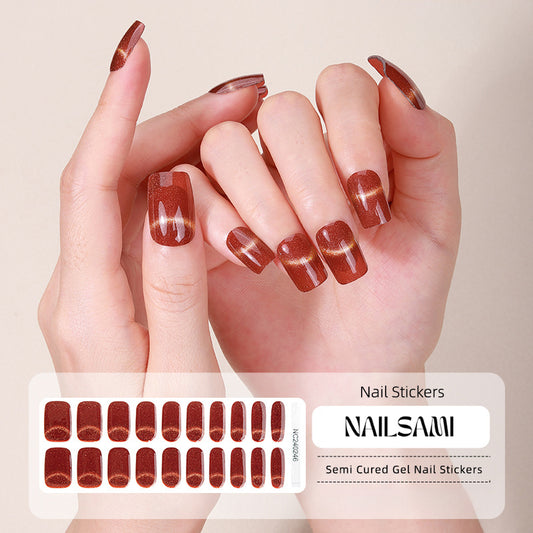 Hand with nails in a deep Bordeaux and plaid gel nail sticker design, with a NAILSAMI gel nail sticker sheet displayed below featuring the same plaid pattern.