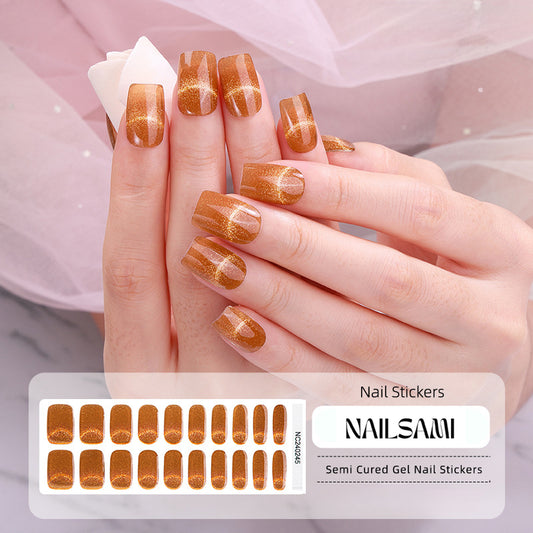 Hand with nails in a warm bronze gel nail sticker design with subtle shimmer, with a NAILSAMI gel nail sticker sheet displayed below showcasing the same bronze design.