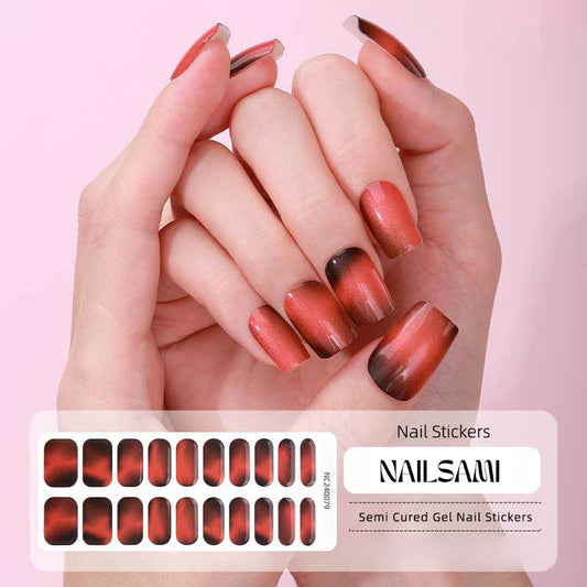 Hand with nails adorned in a burnt orange gradient gel nail sticker design, with a NAILSAMI gel nail sticker sheet displayed below featuring the same orange and red design.