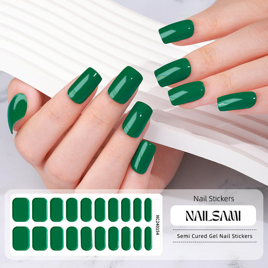 Hand with nails in a rich forest green gel nail sticker design, with a NAILSAMI gel nail sticker sheet displayed below showcasing the same green design.