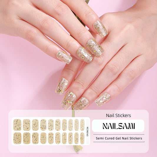 Hand with nails in a luxurious gold glitter gel nail sticker design, with a NAILSAMI gel nail sticker sheet displayed below featuring the same gold glitter design.