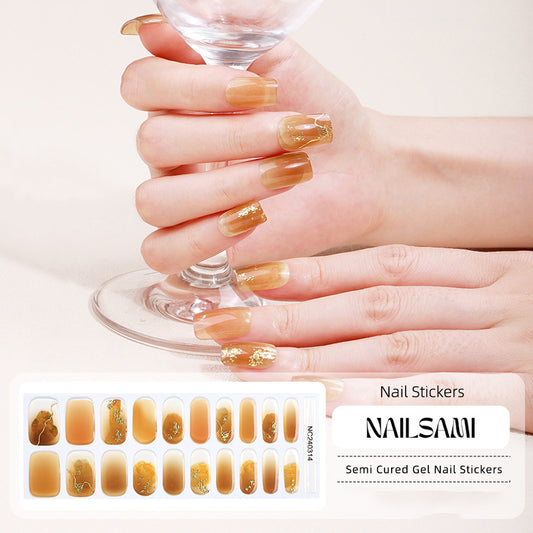 Hand with nails in a warm amber metallic gel nail sticker design, with a NAILSAMI gel nail sticker sheet displayed below showcasing the same amber design.