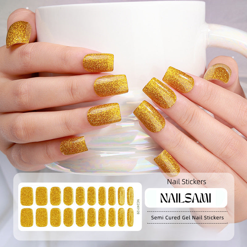 Hand with nails showcasing a luxurious gold glitter gel nail sticker design, with a NAILSAMI gel nail sticker sheet displayed below featuring the same gold glitter design.