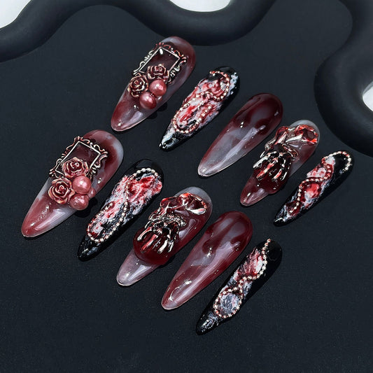 Halloween nails blood drip design with 3D gothic frame and skeleton accents