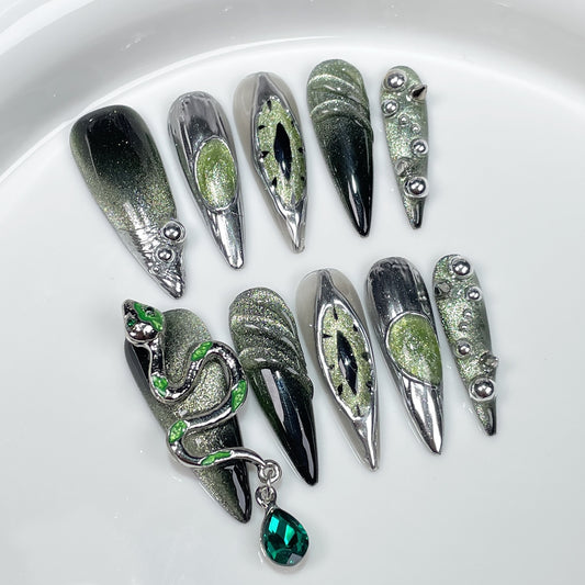 Halloween nails green with 3D snake design and silver accents for a magical look