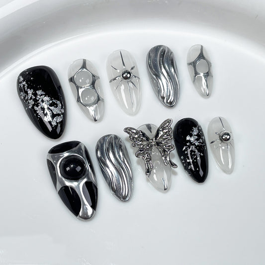 Halloween nails white with 3D spider and butterfly accents for a cute design