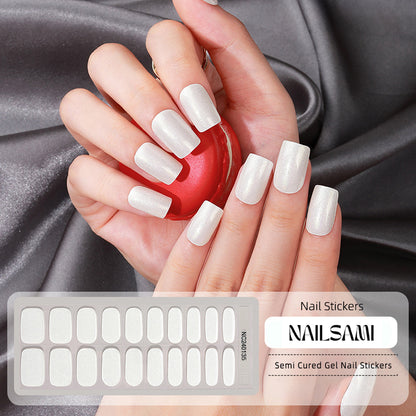 Hand with nails featuring a soft ivory white gel nail sticker design, with a NAILSAMI gel nail sticker sheet displayed below showcasing the same ivory design.