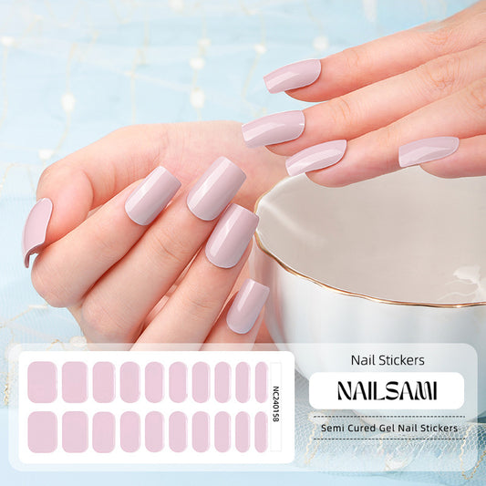 Hand with nails in a soft lavender gel nail sticker design, with a NAILSAMI gel nail sticker sheet displayed below showcasing the same lavender design.