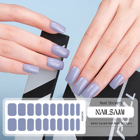 Hand with nails in a soft lavender gel nail sticker design, with a NAILSAMI gel nail sticker sheet displayed below featuring the same lavender design.