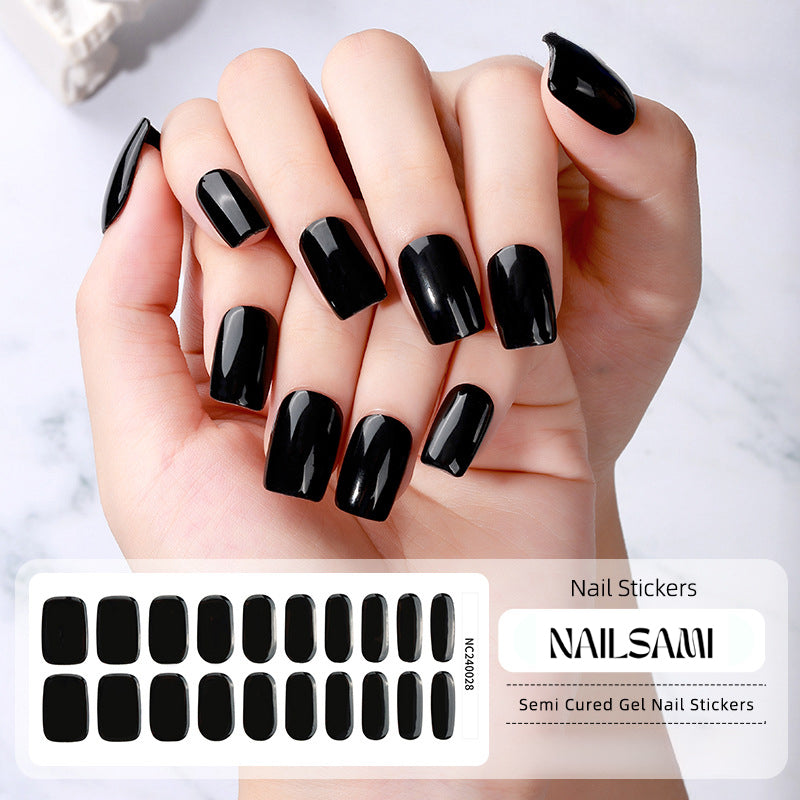 Hand with nails in a solid black gel nail sticker design, with a NAILSAMI gel nail sticker sheet displayed below featuring the same black design.