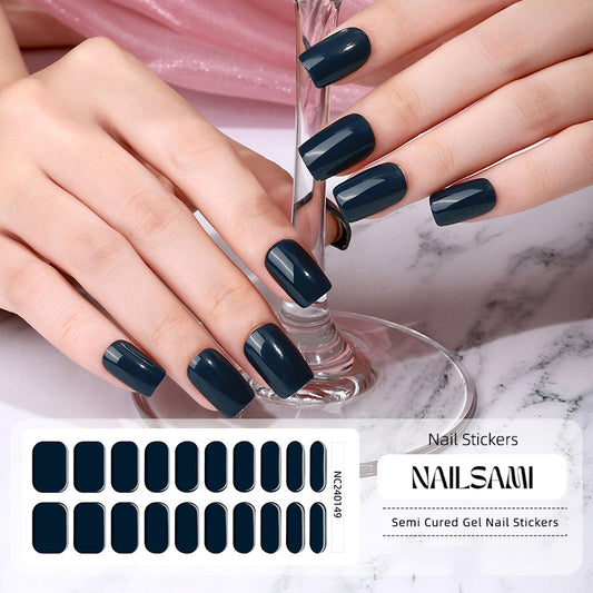 Hand with nails showcasing a rich navy velvet gel nail sticker design, with a NAILSAMI gel nail sticker sheet displayed below featuring the same navy design.