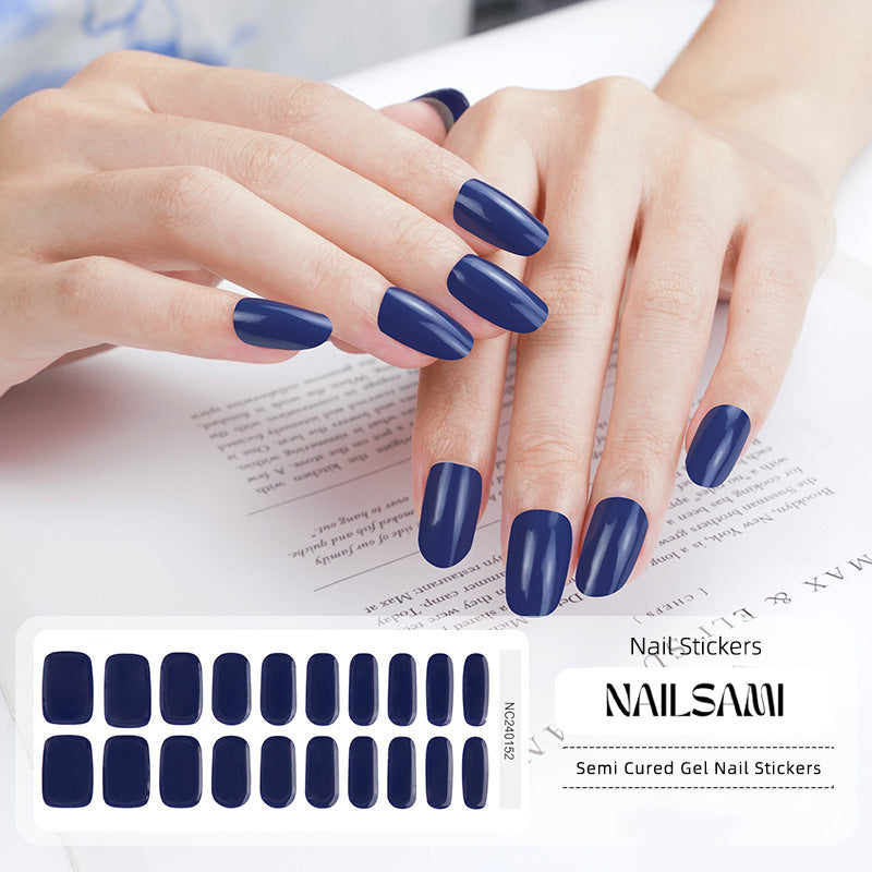 Hand with nails featuring a deep sapphire blue gel nail sticker design, with a NAILSAMI gel nail sticker sheet displayed below showcasing the same blue design.