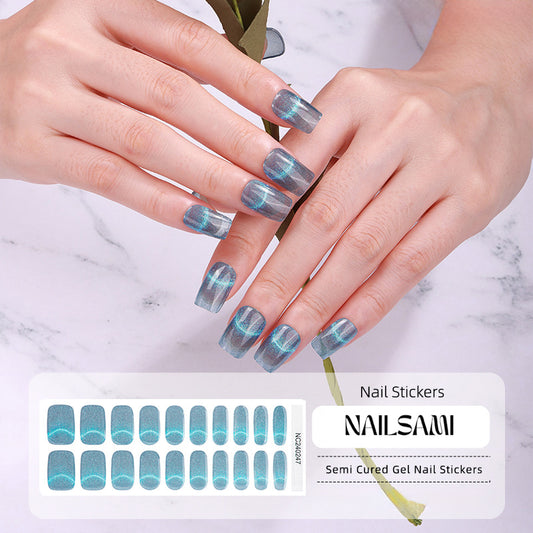 Hand with nails in a cool blue gradient gel nail sticker design, with a NAILSAMI gel nail sticker sheet displayed below featuring the same blue design.