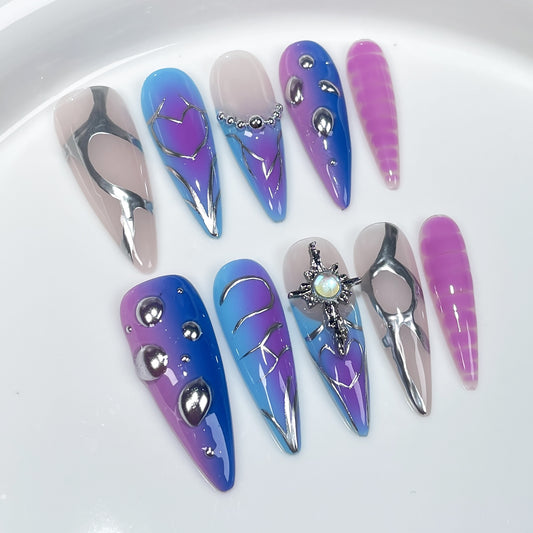 Purple Halloween nail designs with metallic silver and 3D cosmic accents