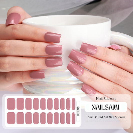 Hand with nails in a warm rosewood gel nail sticker design, with a NAILSAMI gel nail sticker sheet displayed below featuring the same rosewood design.