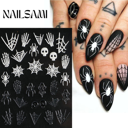 "Spider's Lair - Gothic Critters" nail stickers from NAILSAMI display spiders, webs, and skull designs on a black background, shown on nails styled with black gothic motifs.