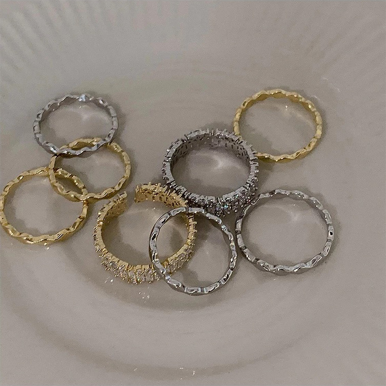 Gold-tone and silver-tone adjustable ring styles displayed together
