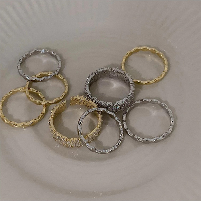 Gold-tone and silver-tone adjustable ring styles displayed together
