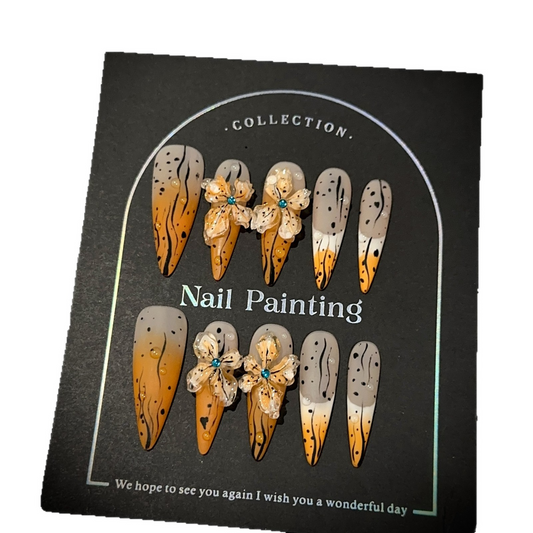 Orange and nude long stiletto press-on nail set with translucent floral accents