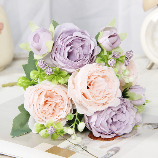 Close view of peach and lavender artificial peony and rose bouquet