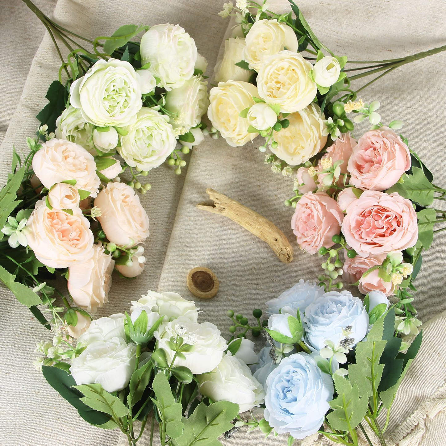 Artificial peony and rose bouquets arranged in multiple colours
