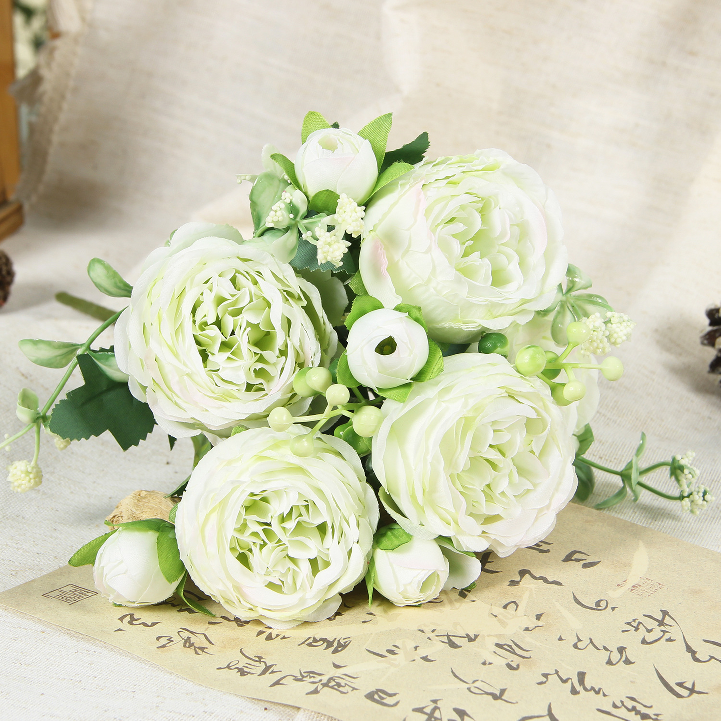 Green artificial peony and rose bouquet