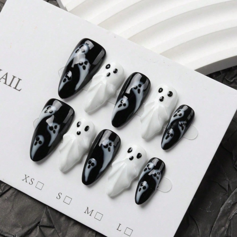 Black and white long almond press-on nail set with sculpted ghost accents