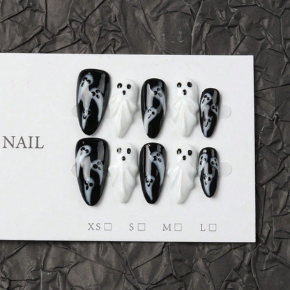 Full black and white Halloween ghost press-on nail design on display card