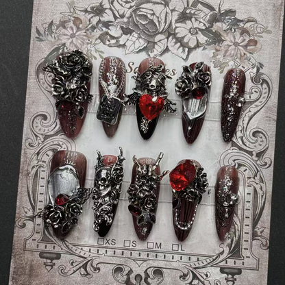 Full burgundy and black skull rose press-on nail design with raised gothic details