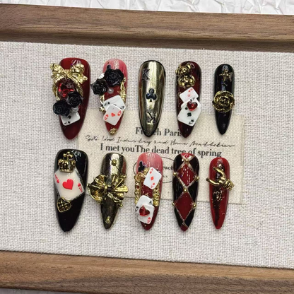 Burgundy black and gold playing-card press-on nail set with roses and raised accents